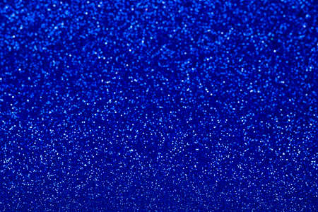 Classic blue abstract background with selective focus. Trendy blue shine and sparkling background.の写真素材