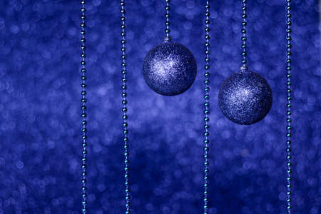 Christmas and New Year trendy blue decoration. Glitter and shine Christmas tree balls and classic...