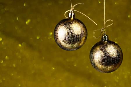Christmas golden, toy balls on glitter and shine classic blue background. Winter holidays retro style composition. Christmas and New Year decoration.の写真素材