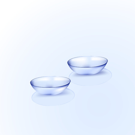 Two isolated contact lenses on light blueのイラスト素材