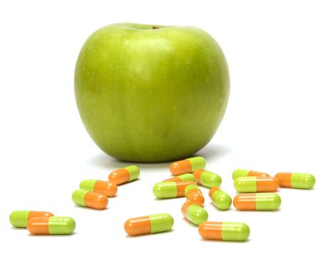 apple and pills isolated on white backgroundの写真素材