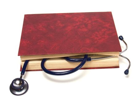 stethoscope on red book isolated on white backgroundの写真素材