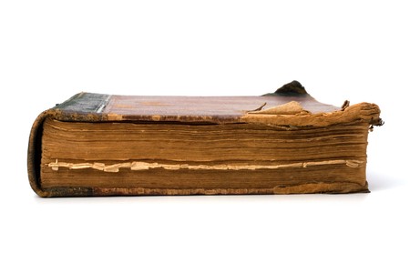 tattered book isolated on white backgroundの写真素材