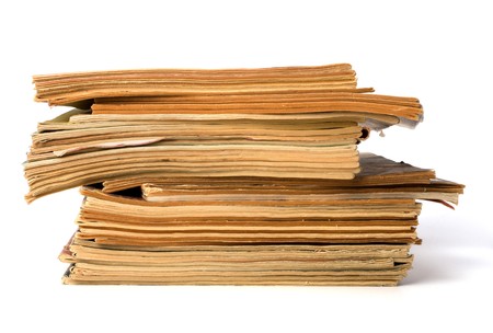 tattered journals stack isolated on white backgroundの写真素材