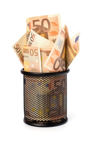 Waste of money concept. Euro currency in garbage bin isolated on white background.の写真素材