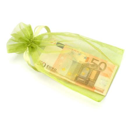 Dotation concept. Money inside gift bag isolated on white background.の写真素材