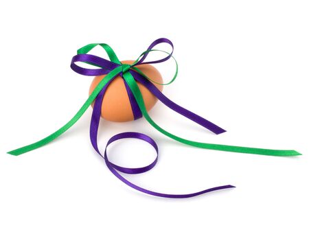 Easter egg with festive bow isolated on white backgroundの写真素材