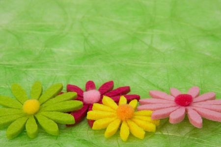 Spring background. Flowers on green sisal background, selective DOF.の写真素材