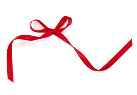 Beautiful red gift ribbon bow isolated on white backgroundの写真素材
