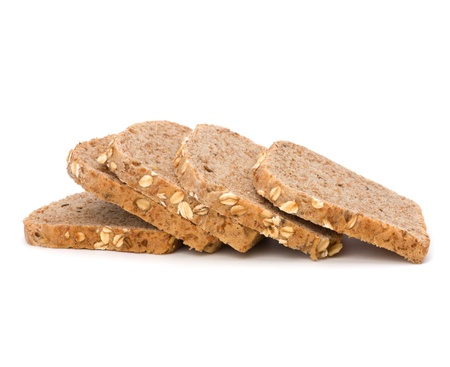 Healthy bran bread slices with rolled oats isolated on white background