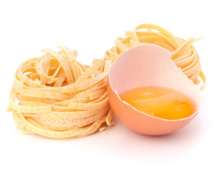 Italian pasta tagliatelle nest isolated on white backgroundの写真素材
