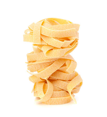 Italian pasta fettuccine nest isolated on white backgroundの写真素材