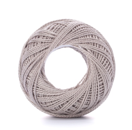 spool of grey thread isolated on white background