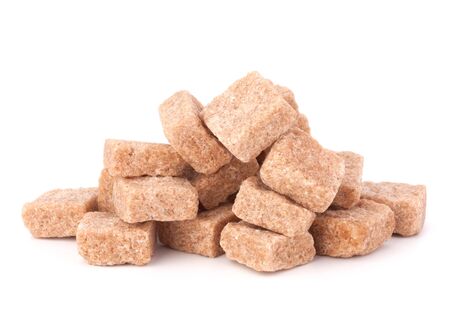 Lump brown cane sugar cubes isolated on white backgroundの写真素材