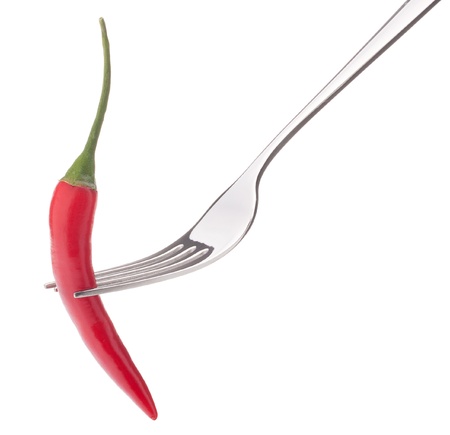 Chili pepper i on fork isolated on white background cutout. Healthy eating concept.の写真素材
