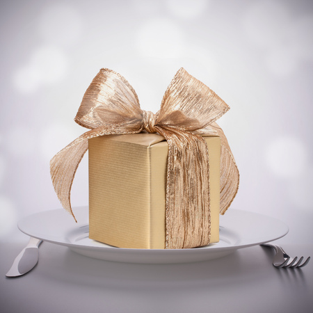 Luxurious gift on plate. Feast concept.の写真素材