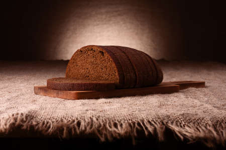 Sliced rye bread on rustic backgroundの写真素材