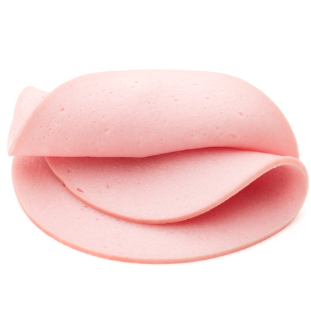 cooked boiled ham sausage or rolled bologna slices isolated on white background cutoutの写真素材