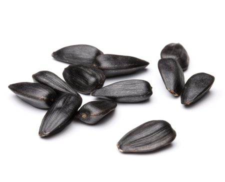 Sunflower seeds  isolated on white background close upの写真素材