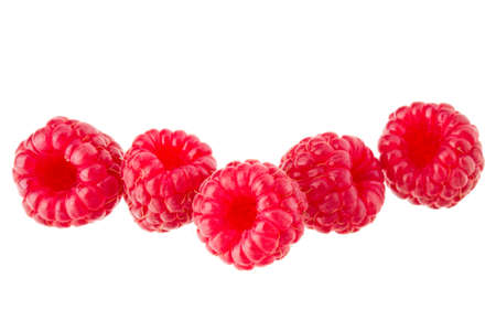 ripe raspberries isolated on white background close upの写真素材