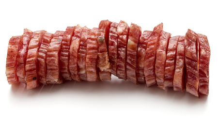 Salami smoked sausage slices isolated on white background cutoutの写真素材