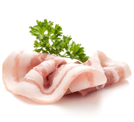 sliced bacon and parsley leaves isolated on white background cutoutの写真素材