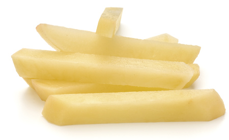 Raw Potato sliced strips prepared for French fries isolated on white backgroundの写真素材
