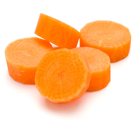 Chopped carrot slices isolated on white background cutoutの写真素材