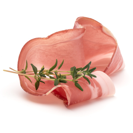 Italian prosciutto crudo or jamon. Raw ham. Isolated on white backgroundの写真素材