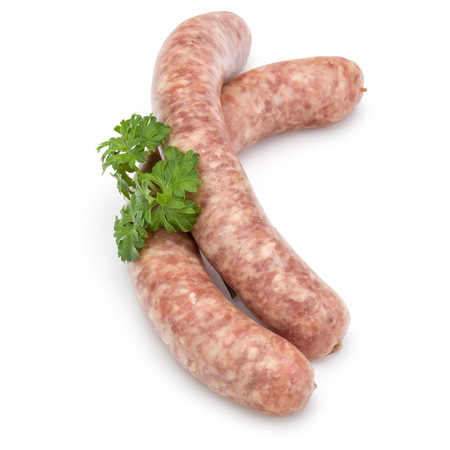 Raw sausage with parsley leaf isolated on white backgroundの写真素材