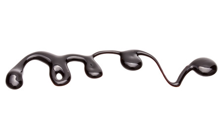 Chocolate syrup drop isolated on white backgroundの写真素材