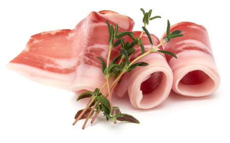 Italian prosciutto crudo or jamon. Raw ham. Isolated on white background