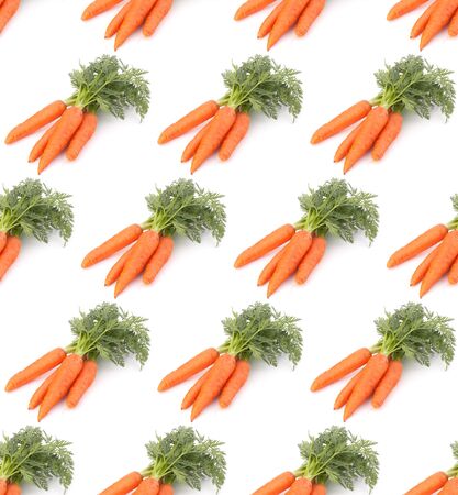 Carrot vegetable with leaves isolated on white background cutout. Seamless food pattern.の写真素材