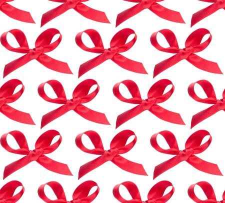 Festive red gift  bow isolated on white background. Seamless pattern.の写真素材