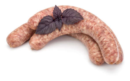 Raw sausage with basil leaf isolated on white backgroundの写真素材