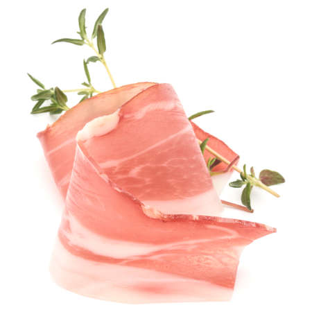 Italian prosciutto crudo or jamon. Raw ham. Isolated on white backgroundの写真素材