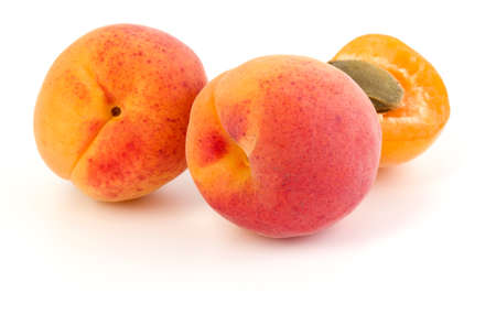 three apricot fruit isolated on white background cutoutの写真素材