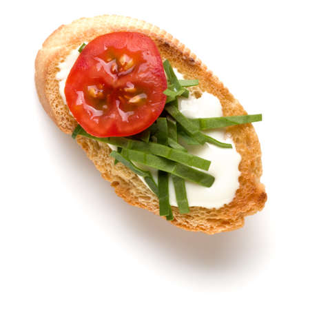 Open faced sandwich canape or crostini isolated on white background closeup. Top view. Vegetarian tartarine.の写真素材