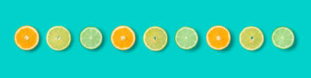 Citrus Fruit pattern on blue background. Orange, Lime, Lemon slices background. Flat lay, top view. Banner, seamless pattern, creative summer food concept.の写真素材