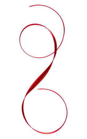 Shiny satin ribbon in red color isolated on white background close up. Ribbon image for decoration design.の写真素材