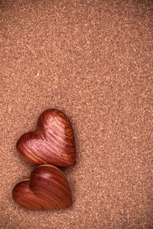 Two wooden hearts on rustic wood background. Valentines days concept.  Love symbol. Greeting card with copy space.の写真素材