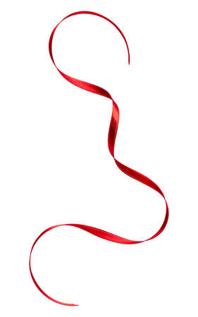 Shiny satin ribbon in red color isolated on white background close up. Ribbon image for decoration design.の写真素材