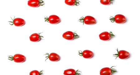Food pattern of cherry tomato isolated on yellow background. Flat lay, top view.の写真素材