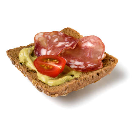 Canape with salami. Open faced sandwich crostini isolated on white background closeup. Appetizer tartarine.の写真素材