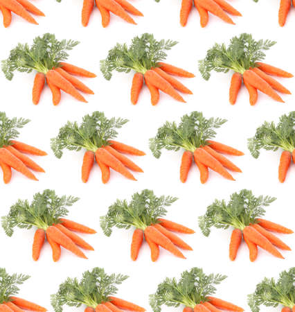 Carrot vegetable with leaves isolated on white background cutout. Seamless food pattern.の写真素材