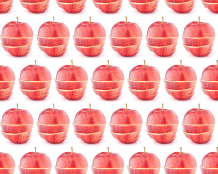 Red sliced apple isolated on white background cutout. Seamless food pattern.の写真素材