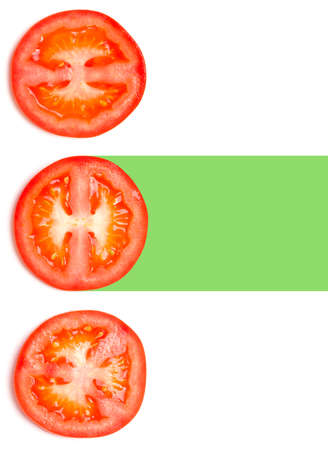Creative layout made of tomato slices. Flat lay, top view. Vegetables isolated on white background. Food ingredient pattern..の写真素材