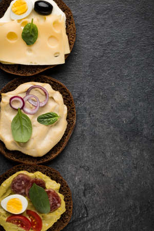 Variety of open sandwiches. Top view, flat lay.