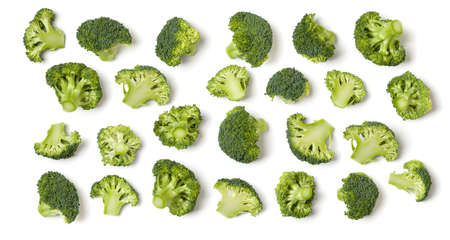 Creative layout made of broccoli. Flat lay, top view. Vegetables isolated over white background. Food ingredient pattern.の写真素材