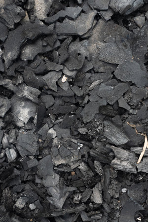 Black coal close up. Background image. Vertical photo